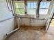Unfinished basement laundry hookups and brick wall at 2724 Peachtree Rd, Statesville, NC 28625