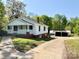 Quaint two-story house with a welcoming porch and convenient driveway at 2724 Peachtree Rd, Statesville, NC 28625