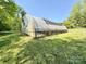 A large greenhouse on a sunny day, perfect for gardening enthusiasts with ample space for plants at 2724 Peachtree Rd, Statesville, NC 28625