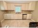 Elegant kitchen featuring white cabinetry, stainless steel appliances, and tile backsplash at 2724 Peachtree Rd, Statesville, NC 28625