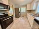 Modern kitchen with stainless steel appliances and plenty of counter space at 2724 Peachtree Rd, Statesville, NC 28625