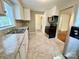 Well-lit kitchen with stainless steel appliances, updated countertops, and ample cabinet space at 2724 Peachtree Rd, Statesville, NC 28625