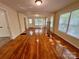 Bright living room with beautiful hardwood flooring and neutral paint at 2724 Peachtree Rd, Statesville, NC 28625