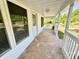 Inviting front porch with white railings, offering a shaded outdoor space at 2724 Peachtree Rd, Statesville, NC 28625