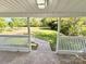 Relaxing porch view of a spacious front yard, perfect for enjoying nature at 2724 Peachtree Rd, Statesville, NC 28625