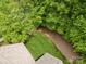 An aerial view shows the layout of the backyard and the mature tree coverage surrounding the home at 3004 Village Ridge Dr, Gastonia, NC 28056