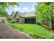 Spacious backyard showcases well-maintained lawn and mature landscaping surrounding the home at 3004 Village Ridge Dr, Gastonia, NC 28056