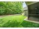 View of a large backyard featuring a screened-in porch and lush green space at 3004 Village Ridge Dr, Gastonia, NC 28056