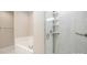 Modern bathroom featuring a shower with white marble-like tile and a separate soaking tub at 3004 Village Ridge Dr, Gastonia, NC 28056