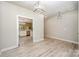 Bright dining room with light wood flooring, modern light fixtures, and an open view to the kitchen at 3004 Village Ridge Dr, Gastonia, NC 28056