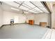 Spacious garage with an epoxy floor, side door, wooden cabinet and room for two vehicles at 3004 Village Ridge Dr, Gastonia, NC 28056
