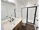 Modern bathroom with sleek black hardware, white subway tile and glass shower door at 3022 Cedar Falls Dr # 16, Waxhaw, NC 28173