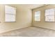 An adaptable bedroom is showcased with natural light and a neutral carpet at 3022 Cedar Falls Dr # 16, Waxhaw, NC 28173