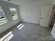 New bedroom featuring large windows, natural lighting, and neutral carpet at 3022 Cedar Falls Dr # 16, Waxhaw, NC 28173