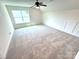 Bonus room with natural light, ceiling fan and neutral carpet at 3022 Cedar Falls Dr # 16, Waxhaw, NC 28173