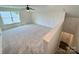 Bonus room featuring neutral carpet, staircase, and natural light at 3022 Cedar Falls Dr # 16, Waxhaw, NC 28173