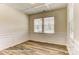 Bright dining room showcasing hardwood floors, traditional molding, coffered ceiling, and large windows at 3022 Cedar Falls Dr # 16, Waxhaw, NC 28173