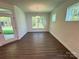 Sunlit dining room featuring luxury vinyl flooring and a modern light fixture at 3022 Cedar Falls Dr # 16, Waxhaw, NC 28173