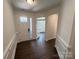 Welcoming foyer featuring elegant molding, beautiful flooring, and a clear view into adjacent rooms at 3022 Cedar Falls Dr # 16, Waxhaw, NC 28173