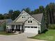 Inviting home with a two-car garage, stone accents, and lush landscaping, perfect for families at 3022 Cedar Falls Dr # 16, Waxhaw, NC 28173
