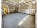 Spacious garage with overhead lighting, door into the home, and outlets at 3022 Cedar Falls Dr # 16, Waxhaw, NC 28173