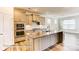 Kitchen boasts a large island, stainless appliances, granite countertops and gray cabinets at 3022 Cedar Falls Dr # 16, Waxhaw, NC 28173