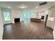 Inviting open living space featuring a gas fireplace, an island kitchen, and lots of natural light at 3022 Cedar Falls Dr # 16, Waxhaw, NC 28173