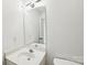 A bright bathroom with a modern light fixture and a large mirror at 3219 Cottage Rose Ln, Rock Hill, SC 29732
