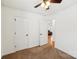 Clean bedroom with neutral carpet, white walls, two doors and view to the living room at 3219 Cottage Rose Ln, Rock Hill, SC 29732