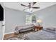 Cozy bedroom with two twin beds, stylish ceiling fan, and neutral decor offering a relaxing retreat at 3300 Bonaire Dr, Charlotte, NC 28208