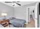 Cozy bedroom featuring hardwood floors, neutral decor, and a lamp providing a warm, inviting atmosphere at 3300 Bonaire Dr, Charlotte, NC 28208