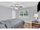 Comfortable bedroom with ceiling fan, natural light, and neutral colors, creating a relaxing atmosphere at 3300 Bonaire Dr, Charlotte, NC 28208