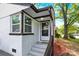 Welcoming entryway featuring a storm door, and a freshly painted brick facade enhancing curb appeal at 3300 Bonaire Dr, Charlotte, NC 28208