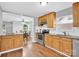 Charming kitchen featuring wood cabinets, stainless steel appliances, and an open layout at 3300 Bonaire Dr, Charlotte, NC 28208