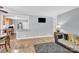 Open-concept layout connecting the dining and living areas, ideal for entertaining and everyday living at 3300 Bonaire Dr, Charlotte, NC 28208