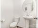 Powder room with modern sink and toilet, and neutral wall color at 334 Bluebonnet Dr, Salisbury, NC 28146