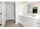 Bright bathroom with a double sink vanity, white cabinets, and modern fixtures at 334 Bluebonnet Dr, Salisbury, NC 28146