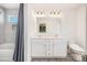 Bathroom with double vanity, shower with tub, and a toilet seat at 334 Bluebonnet Dr, Salisbury, NC 28146