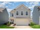 Charming two-story home with attached two-car garage, landscaped yard, and traditional design at 334 Bluebonnet Dr, Salisbury, NC 28146