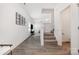 Bright foyer featuring vinyl plank flooring, a staircase, and an adjacent half bathroom at 334 Bluebonnet Dr, Salisbury, NC 28146