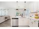 Cozy kitchen with stainless steel appliances, white cabinets, and an open concept to the living room at 334 Bluebonnet Dr, Salisbury, NC 28146