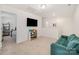 Open living area with a flat-screen TV, a cozy sofa, and neutral decor at 334 Bluebonnet Dr, Salisbury, NC 28146