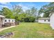 Backyard with an outdoor deck, green lawn, and additional outbuilding at 3378 Tanglewood Dr, Rock Hill, SC 29732