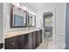 Bathroom with double vanity, granite countertop, decorative mirrors, and a tiled floor at 3378 Tanglewood Dr, Rock Hill, SC 29732