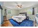Comfortable bedroom with wood floors, a cozy bed, and natural light from the windows at 3378 Tanglewood Dr, Rock Hill, SC 29732