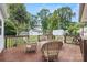 View of outdoor deck featuring wicker furniture and surrounding backyard at 3378 Tanglewood Dr, Rock Hill, SC 29732