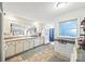 Traditional kitchen with tile floors, white cabinets, and stainless-steel appliances providing a cozy cooking space at 3378 Tanglewood Dr, Rock Hill, SC 29732