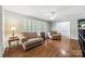 Cozy living room with hardwood floors, neutral paint, ceiling fan, and window shutters at 3378 Tanglewood Dr, Rock Hill, SC 29732
