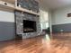 Cozy living room with hardwood floors and a brick fireplace at 3378 Tanglewood Dr, Rock Hill, SC 29732