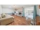 Comfortable living room with hardwood floors, a cozy brick fireplace, and easy access to the sunroom at 3378 Tanglewood Dr, Rock Hill, SC 29732